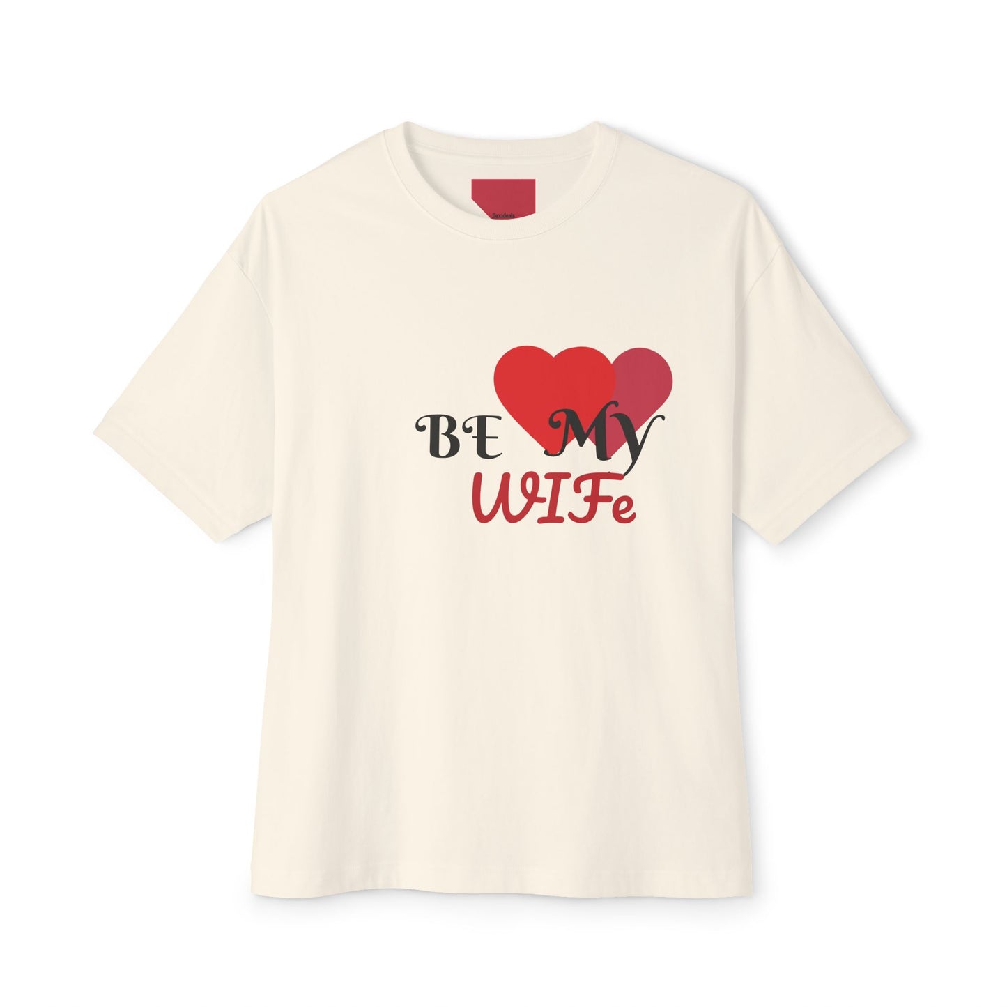 Beige t-shirt with 'Be My Wife' text and heart graphics on a white background